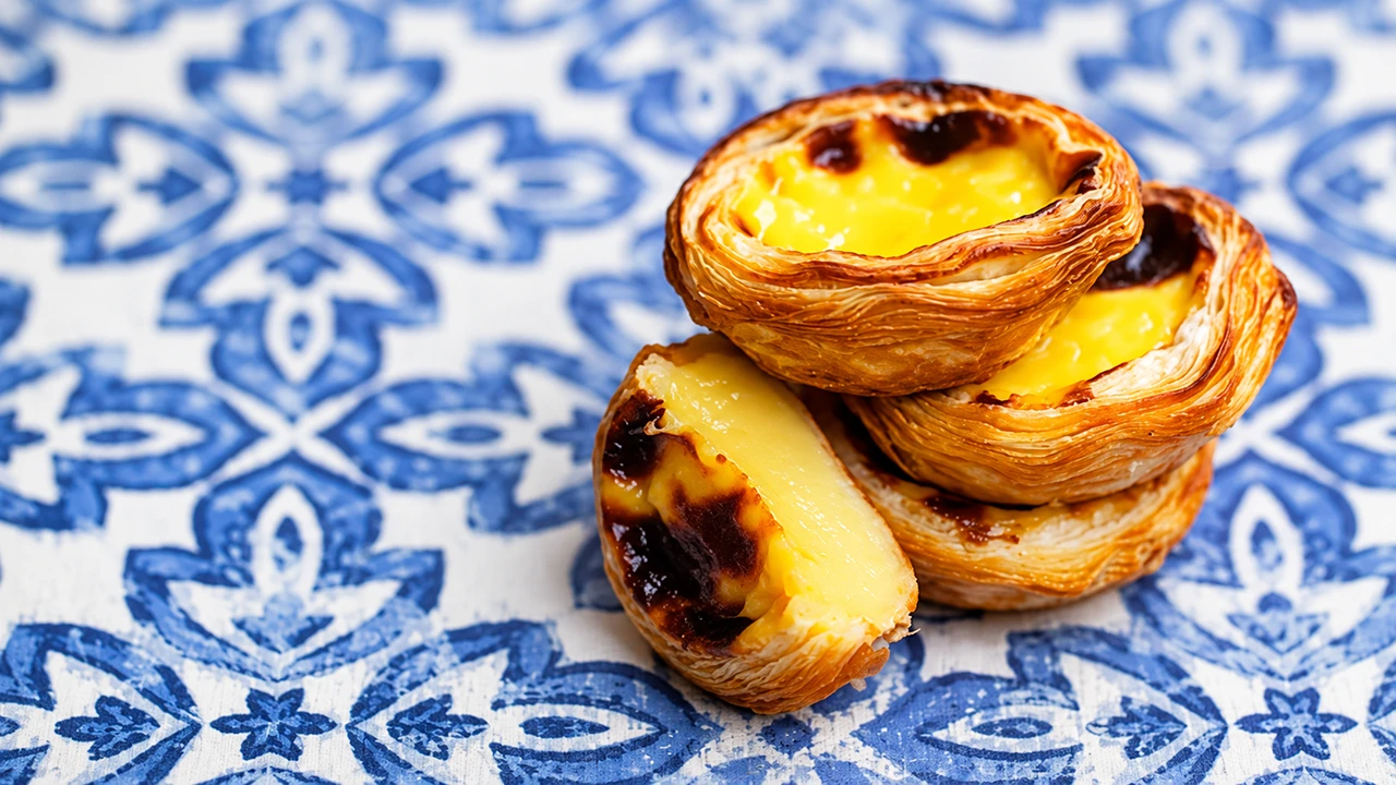 Pastéis de nata on blue-and-white azulejo tiles